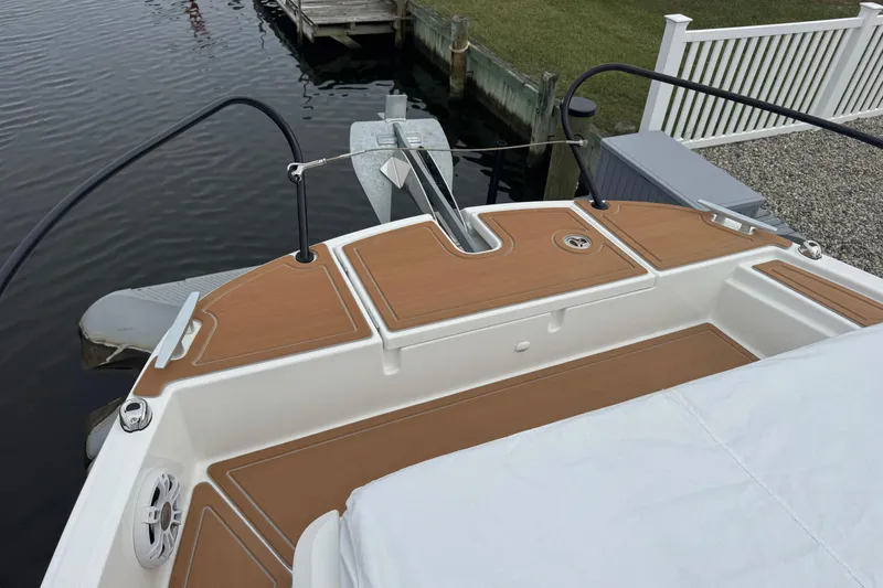  Yacht Photos Pics 2024 Beneteau Flyer 9 SUNdeck boat with teak deck, docked by water.