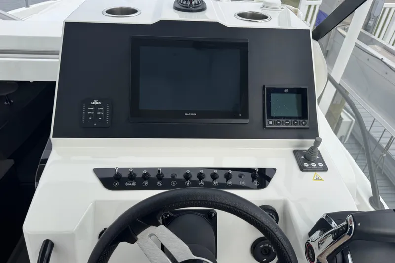  Yacht Photos Pics 2024 Beneteau Flyer 9 SUNdeck helm with modern controls and navigation displays.