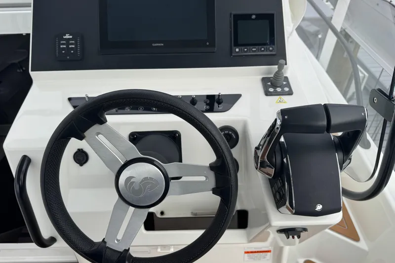  Yacht Photos Pics 2024 Beneteau Flyer 9 SUNdeck helm with steering wheel and control panel.