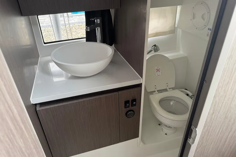  Yacht Photos Pics Modern bathroom interior of 2024 Beneteau Flyer 9 SUNdeck with sink and toilet.