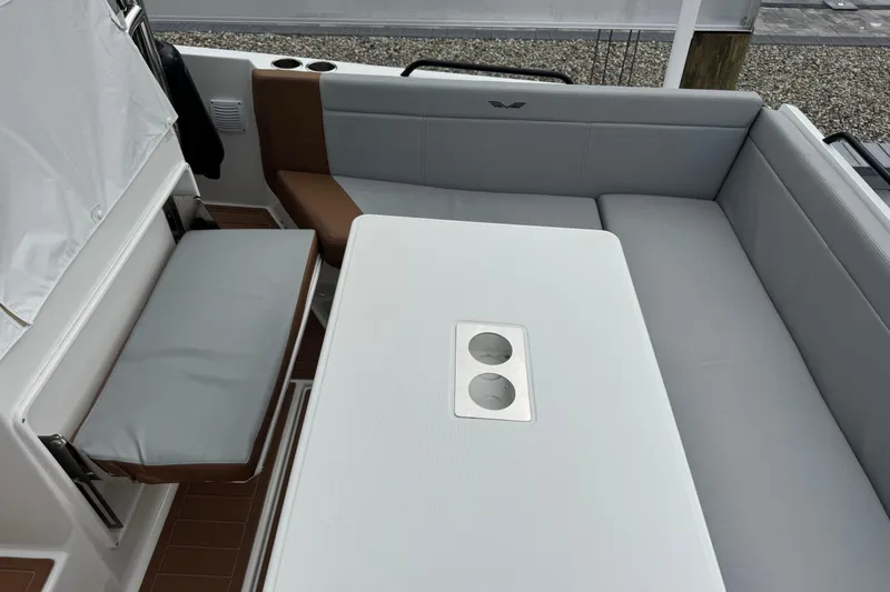  Yacht Photos Pics 2024 Beneteau Flyer 9 SUNdeck interior with sleek seating and table design.