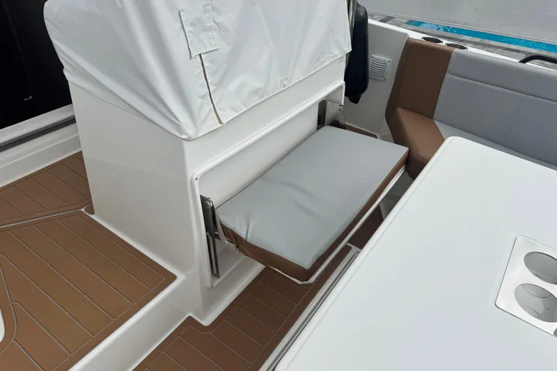  Yacht Photos Pics 2024 Beneteau Flyer 9 SUNdeck interior with seating and table, featuring modern design.