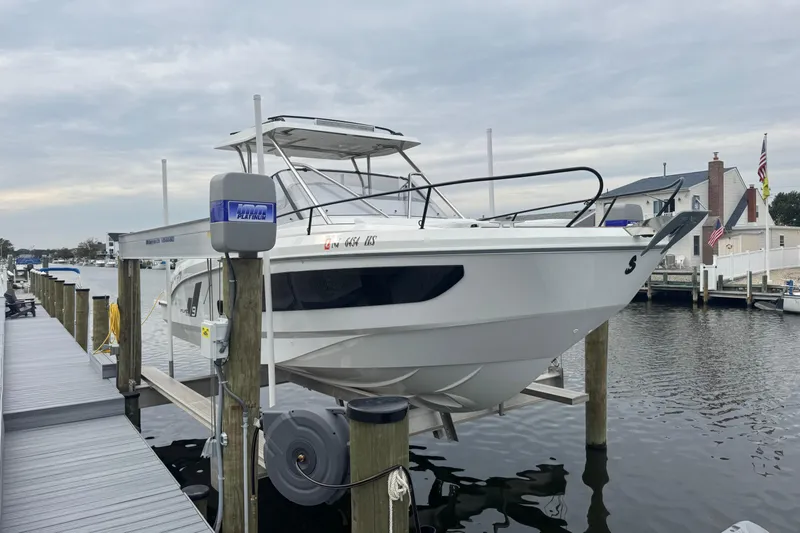  Yacht Photos Pics 2024 Beneteau Flyer 9 SUNdeck boat docked at a marina, showcasing sleek design.