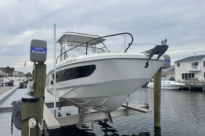 Yacht Photos Pics 2024 Beneteau Flyer 9 SUNdeck boat docked, showcasing sleek design and modern features.