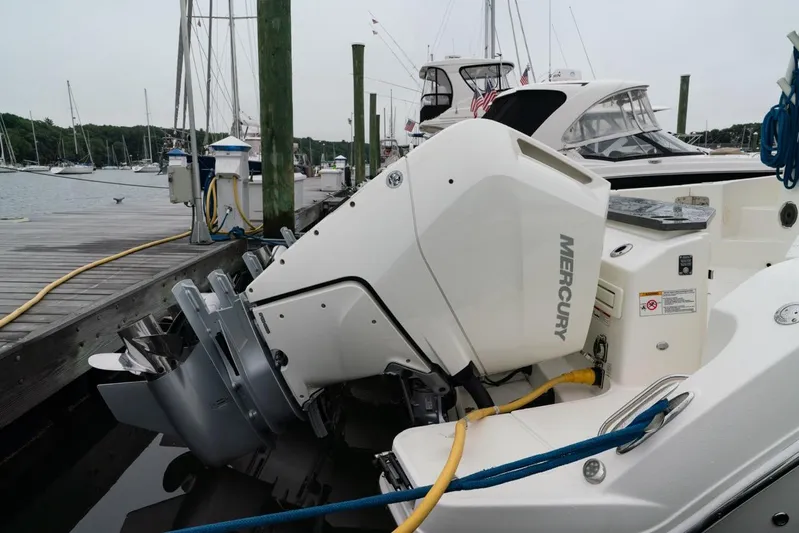  Yacht Photos Pics 2024 Boston Whaler 405 Conquest with Mercury outboard engine docked at marina.