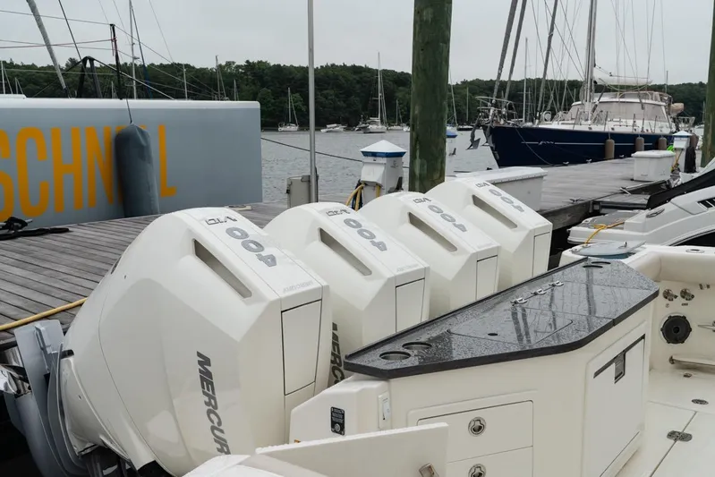  Yacht Photos Pics 2024 Boston Whaler 405 Conquest with quad Mercury 400 engines docked at marina.