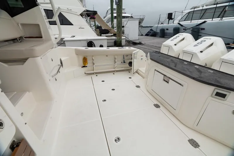  Yacht Photos Pics 2024 Boston Whaler 405 Conquest boat deck with outboard engines and storage compartments.
