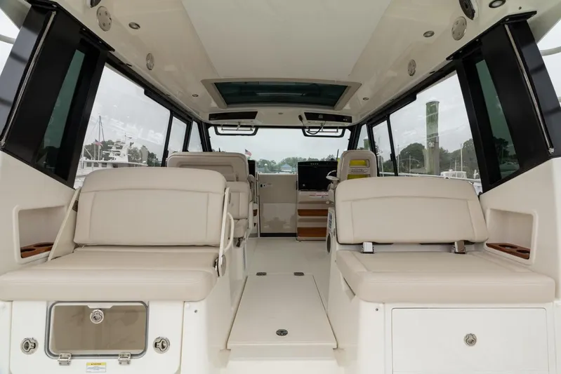 Yacht Photos Pics Interior of 2024 Boston Whaler 405 Conquest boat, featuring spacious seating and modern design.