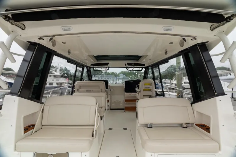  Yacht Photos Pics 2024 Boston Whaler 405 Conquest interior with luxurious seating and modern design.