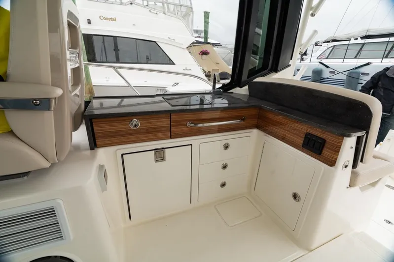  Yacht Photos Pics 2024 Boston Whaler 405 Conquest interior with sleek cabinetry and modern design.