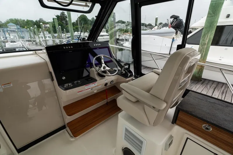  Yacht Photos Pics 2024 Boston Whaler 405 Conquest helm with modern controls and comfortable seating.