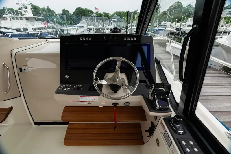  Yacht Photos Pics 2024 Boston Whaler 405 Conquest helm with modern controls and navigation system.