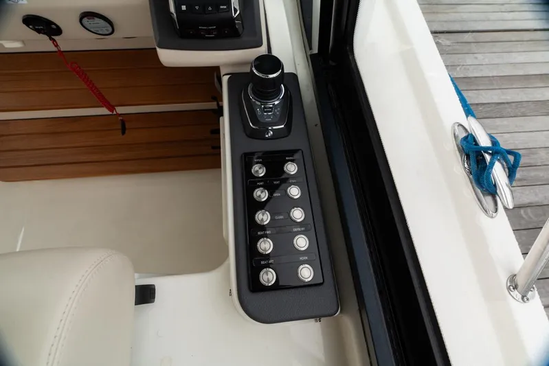  Yacht Photos Pics Control panel of 2024 Boston Whaler 405 Conquest boat, featuring buttons and joystick.