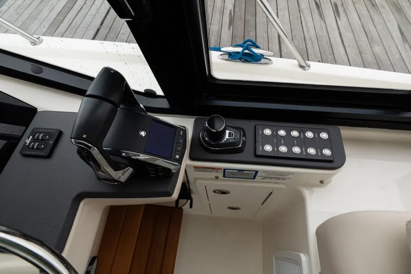  Yacht Photos Pics 2024 Boston Whaler 405 Conquest helm controls with joystick and display.