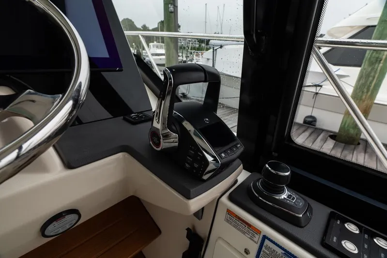  Yacht Photos Pics 2024 Boston Whaler 405 Conquest helm with modern controls and steering wheel.