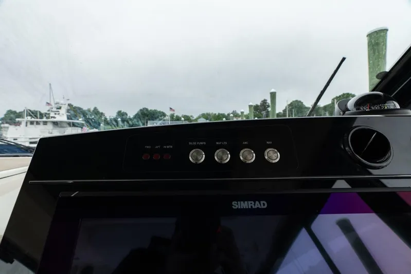  Yacht Photos Pics Control panel of 2024 Boston Whaler 405 Conquest with Simrad display and switches.
