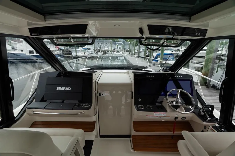  Yacht Photos Pics 2024 Boston Whaler 405 Conquest helm with advanced navigation systems and luxurious interior.