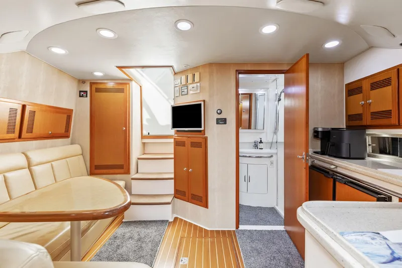 Ryfly Yacht Photos Pics Luxurious interior of a 2004 Cabo 40 Express yacht with modern amenities.