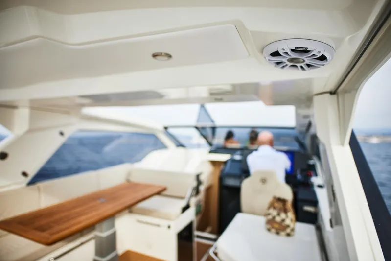  Yacht Photos Pics Interior of 2025 Skamander Sorrento yacht with seating and navigation area.