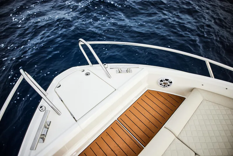  Yacht Photos Pics 2025 Skamander Sorrento boat deck with wood finish, overlooking deep blue ocean.