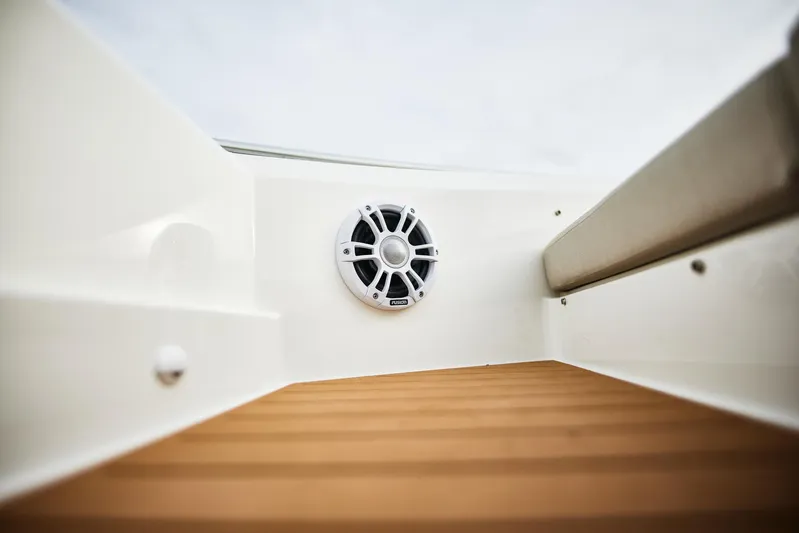  Yacht Photos Pics 2025 Skamander Sorrento boat interior with speaker and wooden flooring.