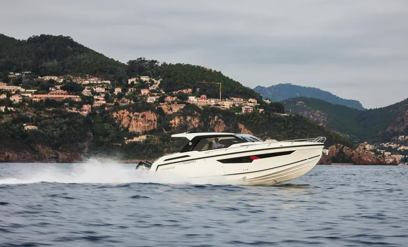  Yacht Photos Pics 2025 Skamander Sorrento boat cruising on scenic coastal waters.