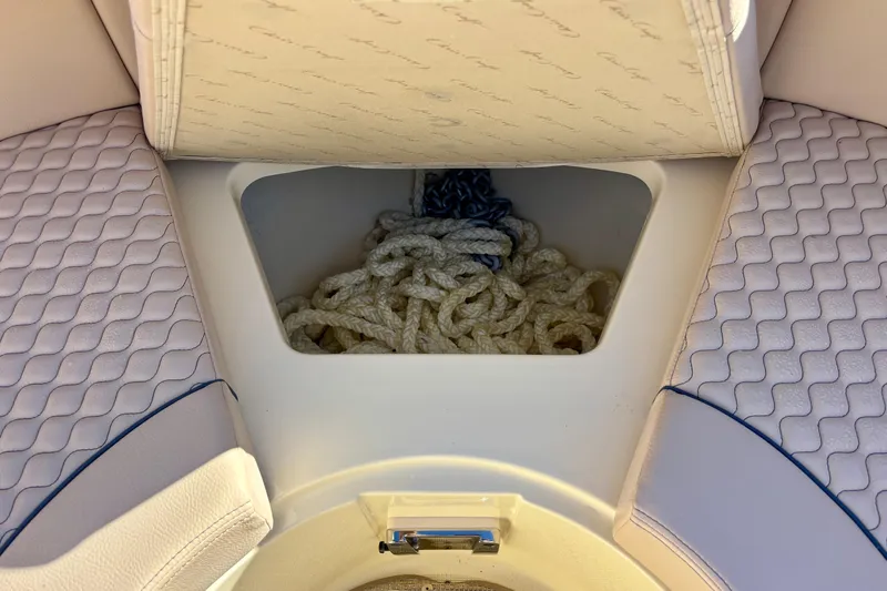  Yacht Photos Pics 2026 Chris-Craft Launch 31 GT boat storage compartment with ropes and cushioned seating.