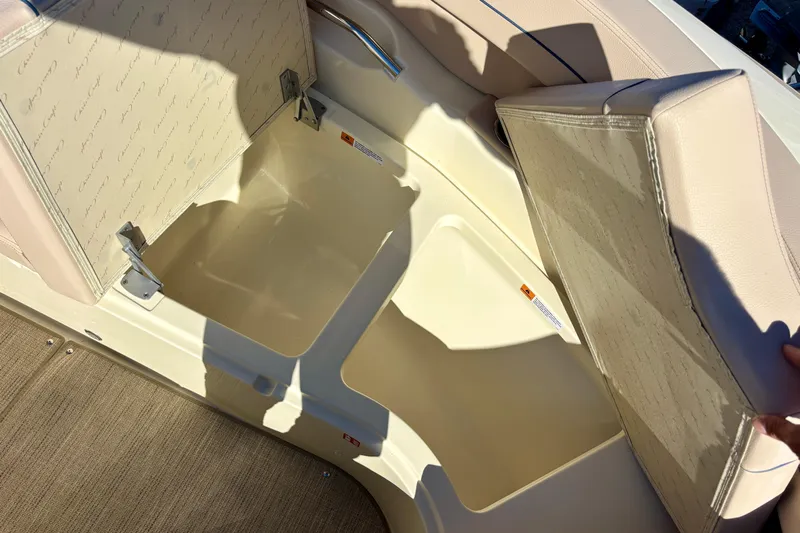  Yacht Photos Pics 2026 Chris-Craft Launch 31 GT boat storage compartment with beige cushioned seating.