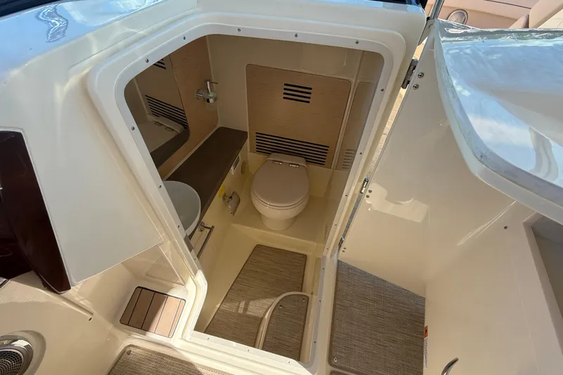  Yacht Photos Pics 2026 Chris-Craft Launch 31 GT boat interior bathroom with modern fixtures and compact design.