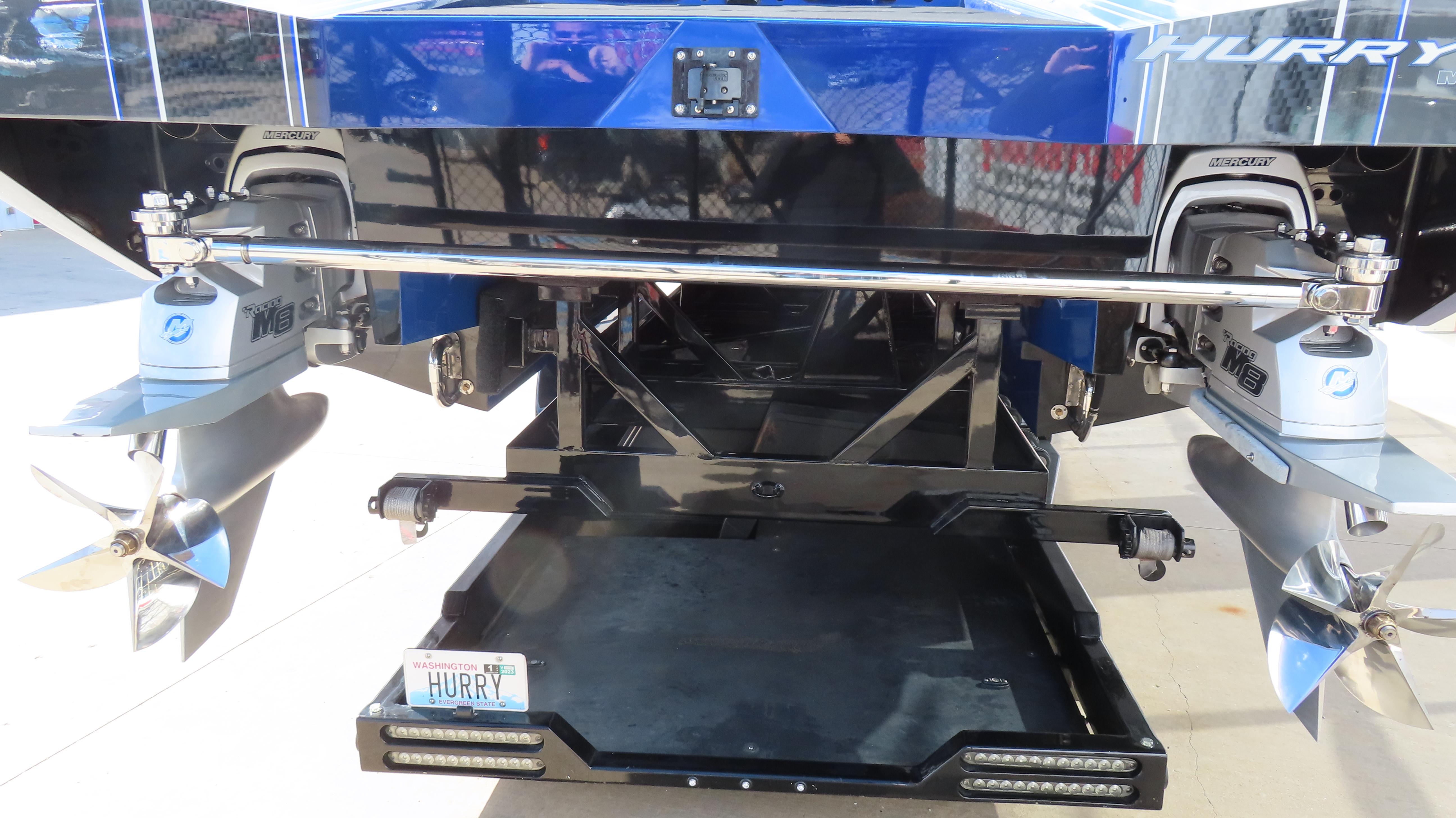 2020 Outerlimits 46SC boat rear view with dual propellers and license plate.