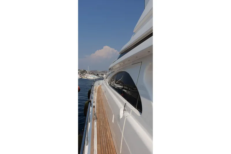  Yacht Photos Pics Side view of a 2008 Leopard 105 yacht on calm water.