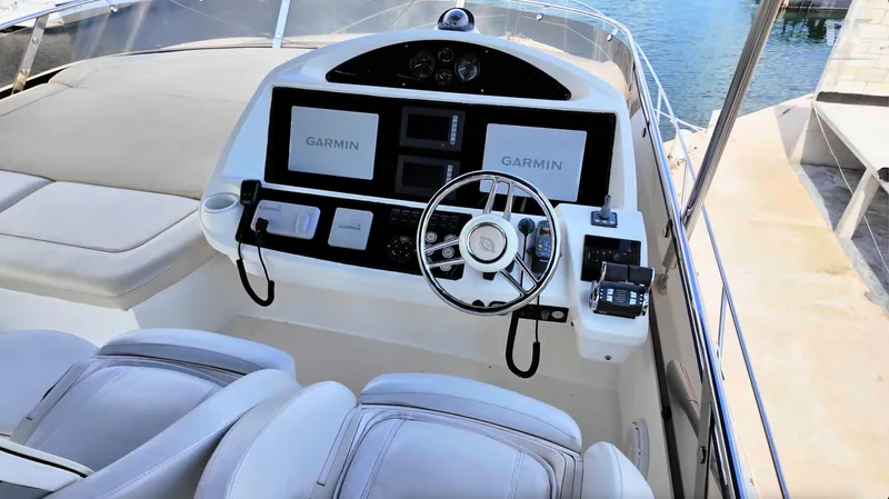 Phantom Yacht Photos Pics Helm of 2011 Sunseeker Manhattan 63 yacht with Garmin navigation displays.