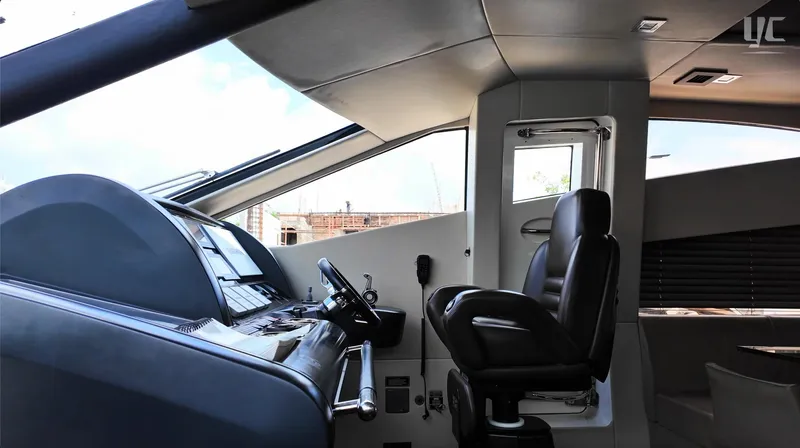 Phantom Yacht Photos Pics Interior helm of 2011 Sunseeker Manhattan 63 yacht, featuring modern controls and seating.