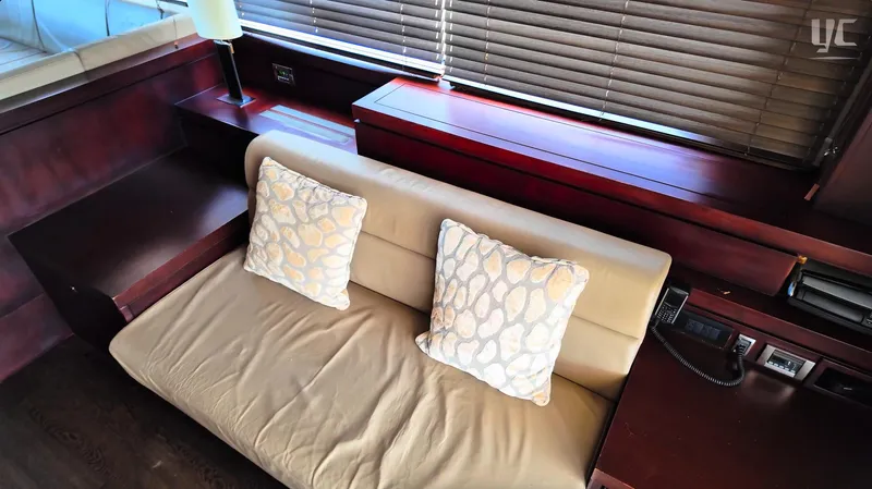 Phantom Yacht Photos Pics Luxurious interior of 2011 Sunseeker Manhattan 63 yacht with plush seating and elegant decor.