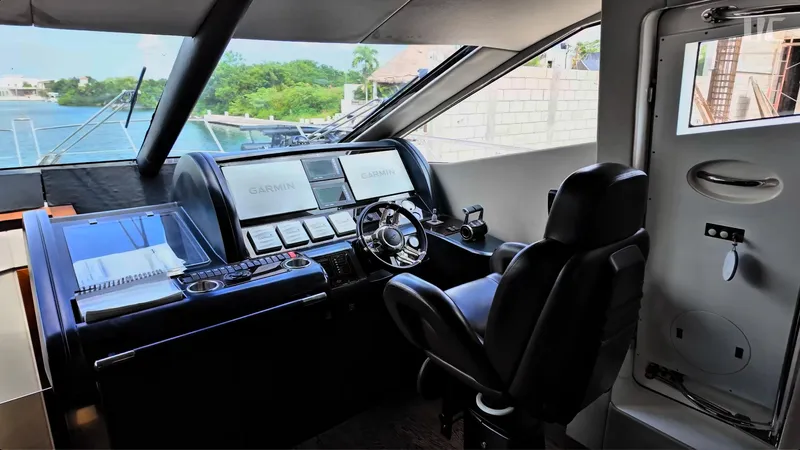 Phantom Yacht Photos Pics Helm of 2011 Sunseeker Manhattan 63 yacht with Garmin navigation system.