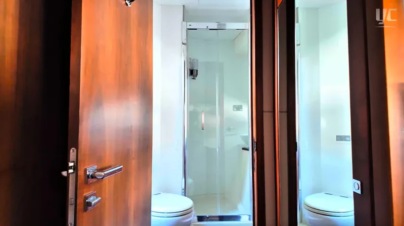 Phantom Yacht Photos Pics Luxurious bathroom in 2011 Sunseeker Manhattan 63 yacht with modern shower and wooden accents.