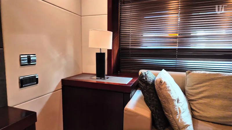 Phantom Yacht Photos Pics Luxurious interior of 2011 Sunseeker Manhattan 63 yacht with elegant lamp and plush cushions.