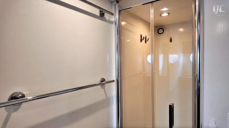 Phantom Yacht Photos Pics Interior of 2011 Sunseeker Manhattan 63 yacht, featuring sleek shower area with chrome accents.