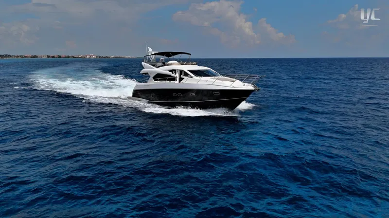 Phantom Yacht Photos Pics Sunseeker Manhattan 63 yacht cruising on open sea, 2011 model.