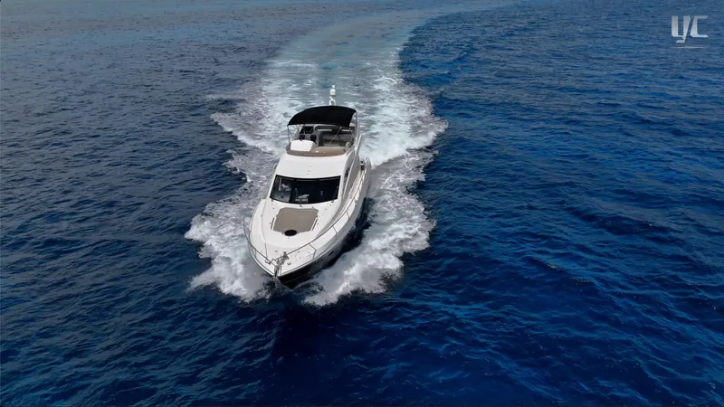 Phantom Yacht Photos Pics Luxury Sunseeker Manhattan 63 yacht cruising on open blue sea, 2011 model.