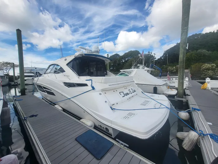 Tam- E- Lee Yacht Photos Pics 2013 Sea Ray 510 Sundancer yacht docked at marina under blue sky.