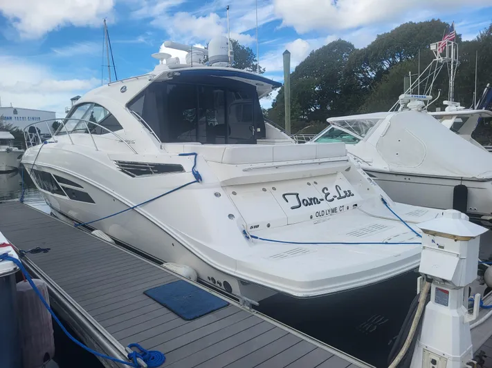 Tam- E- Lee Yacht Photos Pics 2013 Sea Ray 510 Sundancer yacht docked at marina under blue sky.