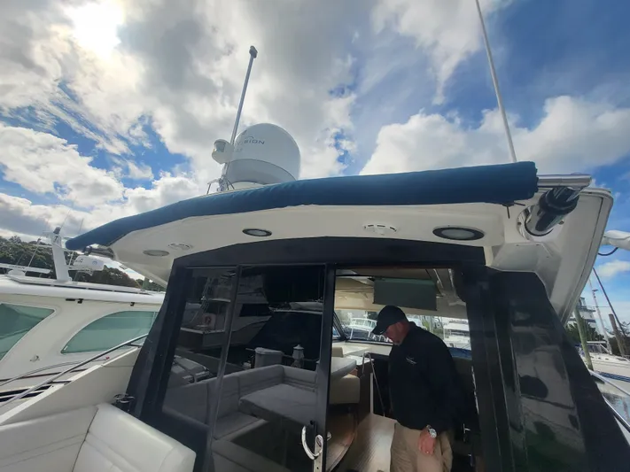 Tam- E- Lee Yacht Photos Pics 2013 Sea Ray 510 Sundancer yacht with a person on deck under a cloudy sky.