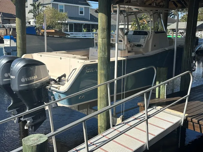  Yacht Photos Pics 2020 Grady-White Canyon 306 boat docked with dual Yamaha engines.