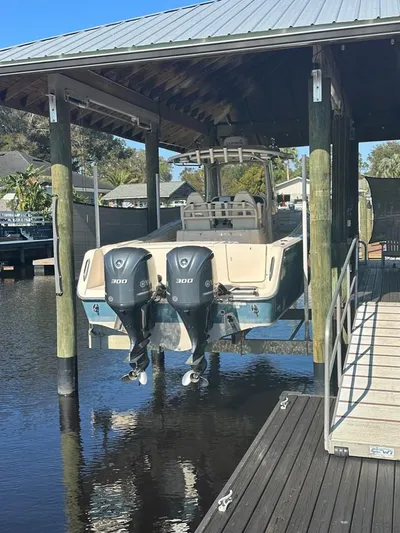  Yacht Photos Pics 2020 Grady-White Canyon 306 boat with dual engines docked in a covered marina.
