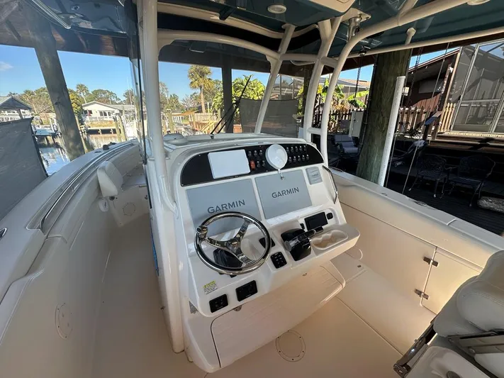  Yacht Photos Pics 2020 Grady-White Canyon 306 boat helm with Garmin navigation systems.