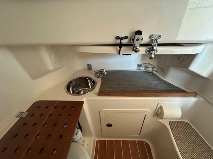  Yacht Photos Pics 2020 Grady-White Canyon 306 boat interior with sink and storage area.