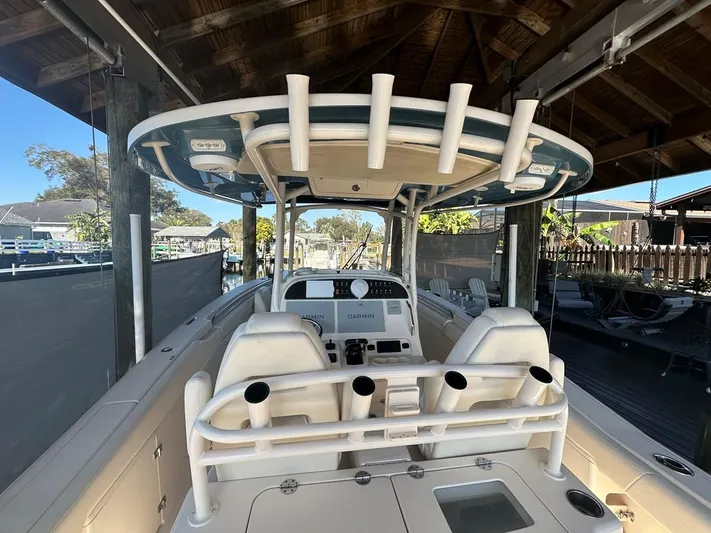  Yacht Photos Pics 2020 Grady-White Canyon 306 boat interior under a wooden shelter.