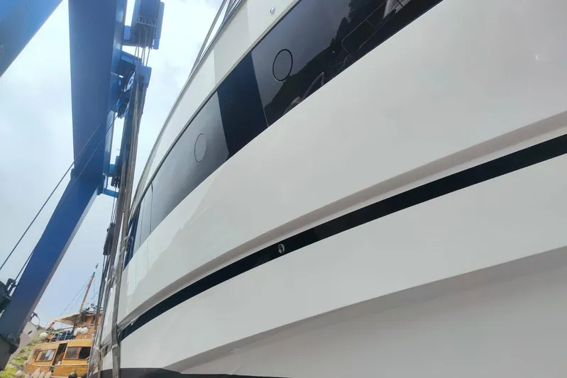 Elixa Yacht Photos Pics 2022 Sunseeker Manhattan 68 yacht side view during maintenance.