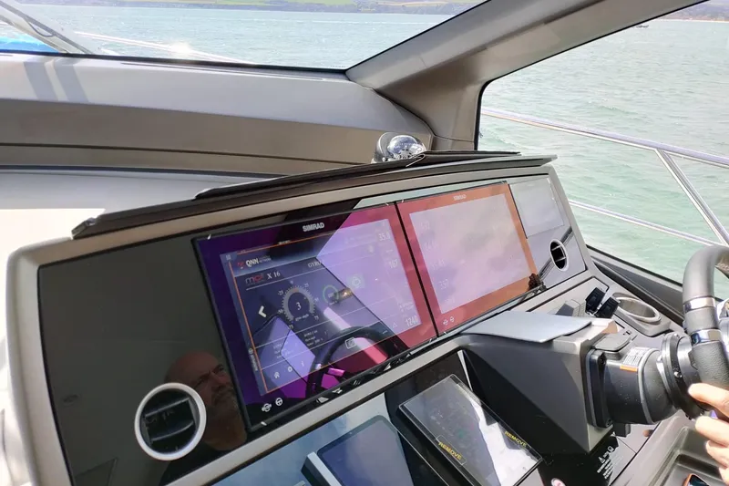 Elixa Yacht Photos Pics Helm of 2022 Sunseeker Manhattan 68 yacht with advanced navigation displays.